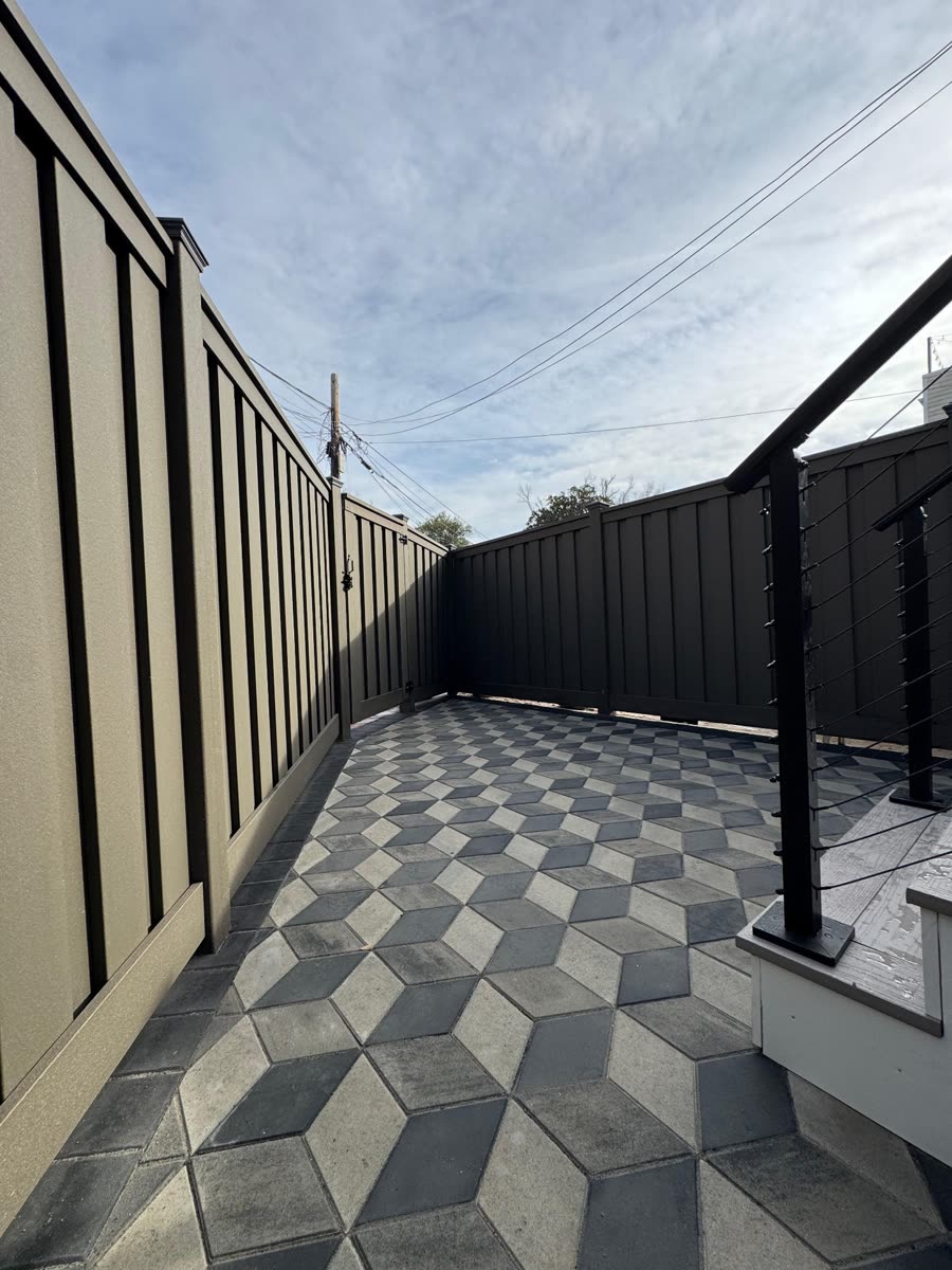 Geometric paver patio with privacy fence